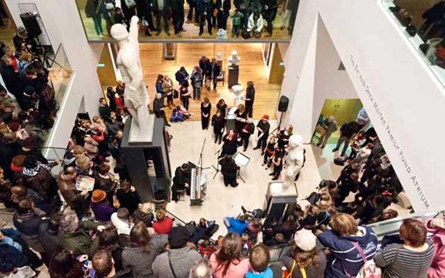 Busy atrium in the Ashmolean Museum during a late night event