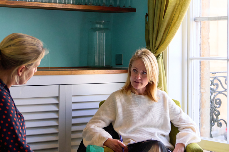 two women sitting having a conversation 