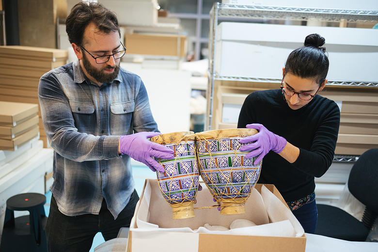 Collections Move team moving objects in the Pitt Rivers Museum collection