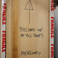 object that says: This way up at all times, mercury