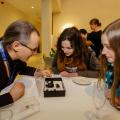 GLAM staff looking at collections with a curator at the GLAM Staff Event in January 2018 at the Weston Library