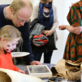 Father and daughter engaging with collections together