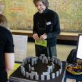 GLAM Staff looking at Stonehenge model at GLAM Staff Event in January 2018 at the Weston Library