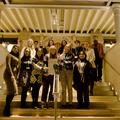 Photograph of a group of people on the entrance steps to the Pitt Rivers Museum