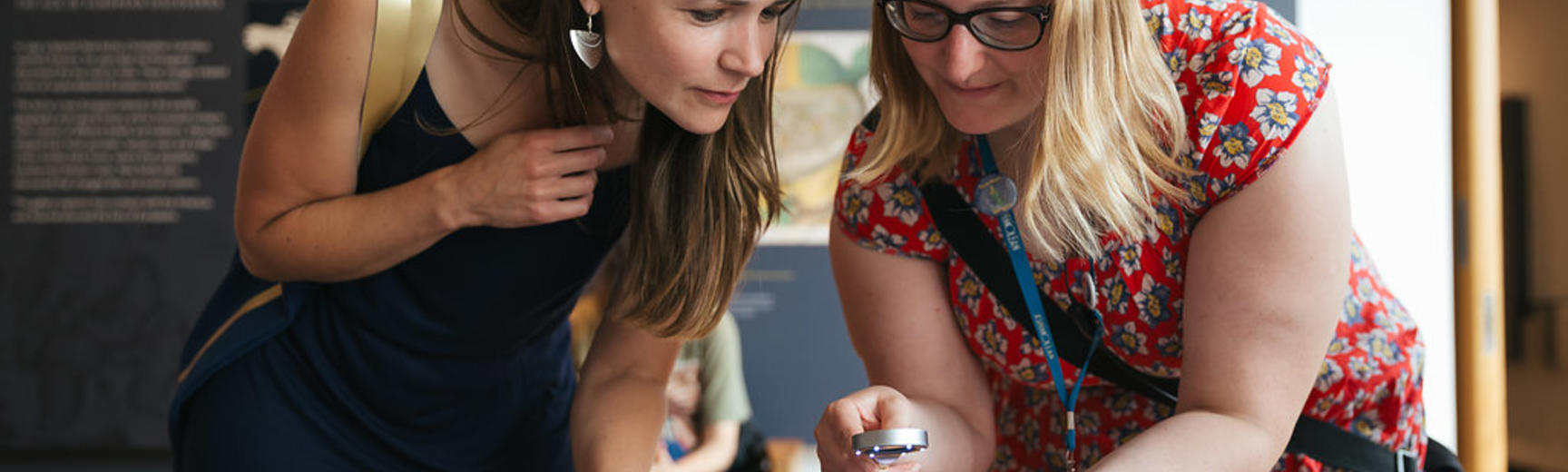 Two adults looking at collections