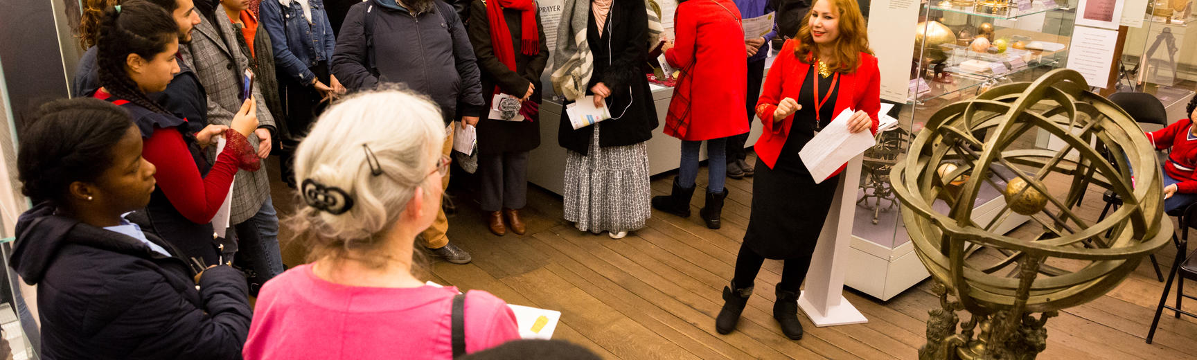 multaka oxford volunteer dhamyaa abass presents to a large group at the History of Science Museum