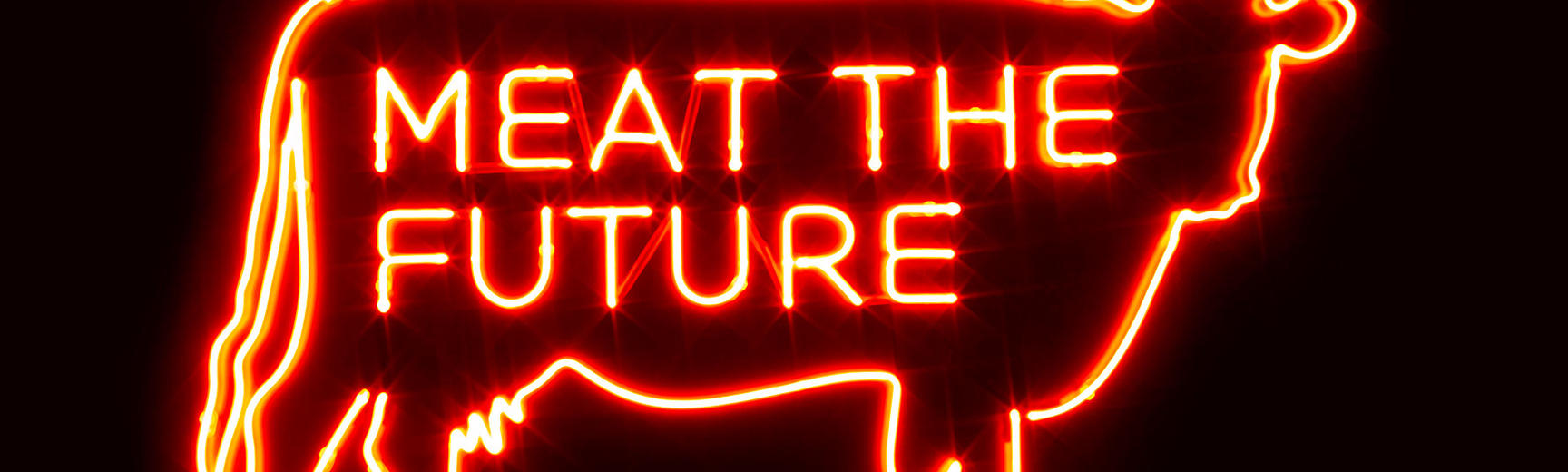 Neon sign of cow with Meat the Future