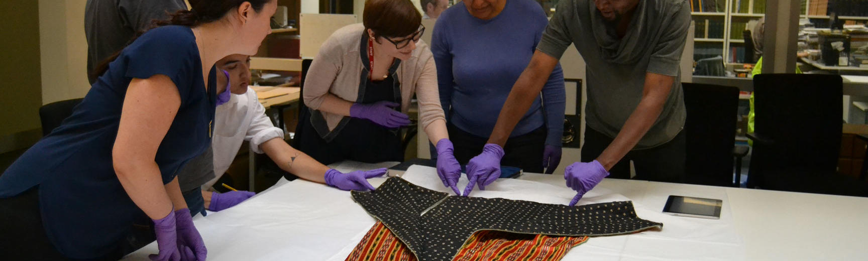 Researchers looking at collections