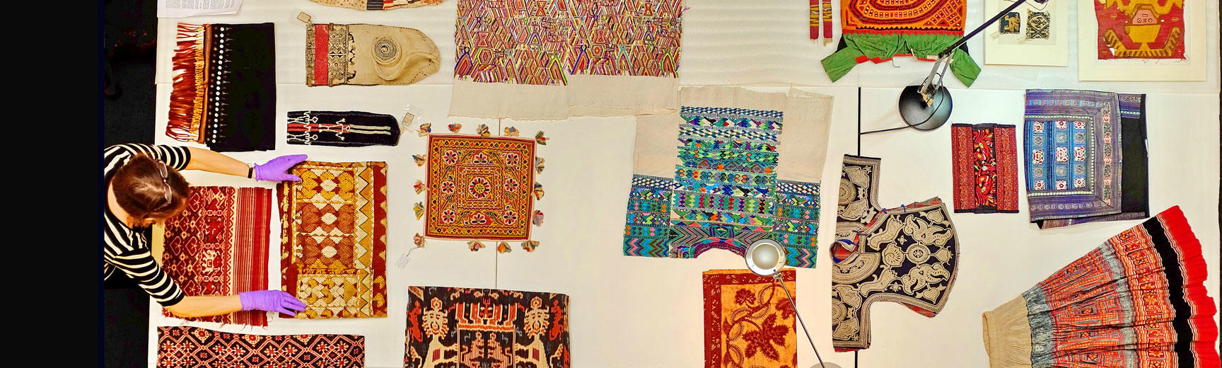 Curator preparing textile items for researchers