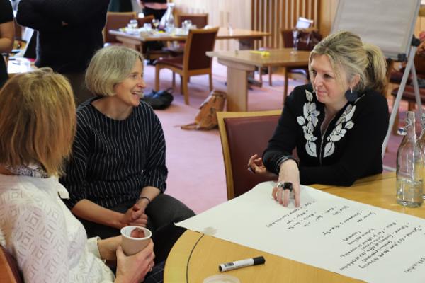 Three delegates in discussion