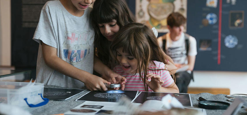 Children engaging with archaeology activity