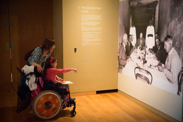 A wheelchair user visiting an exhibition at the Ashmolean