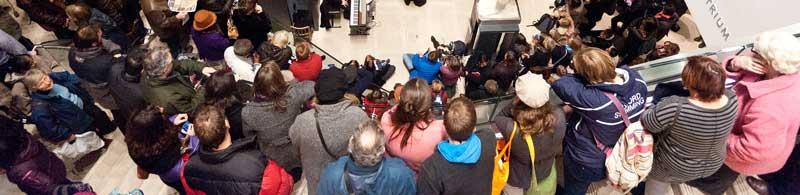 Busy Atrium in the Ashmolean Museum during a late night event Large group listening to event in the Atrium at the Ashmolean Museum