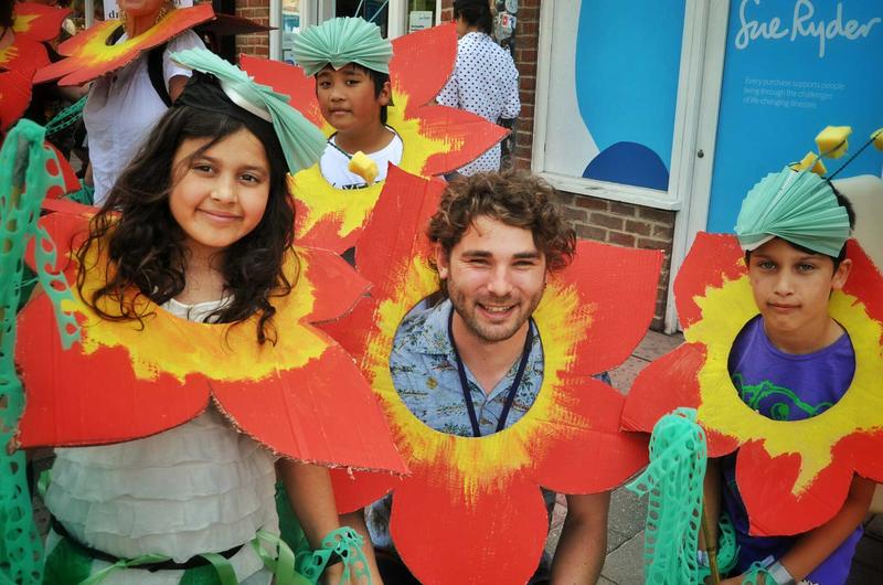 Group participating in family activity at Cowley Road Carnival