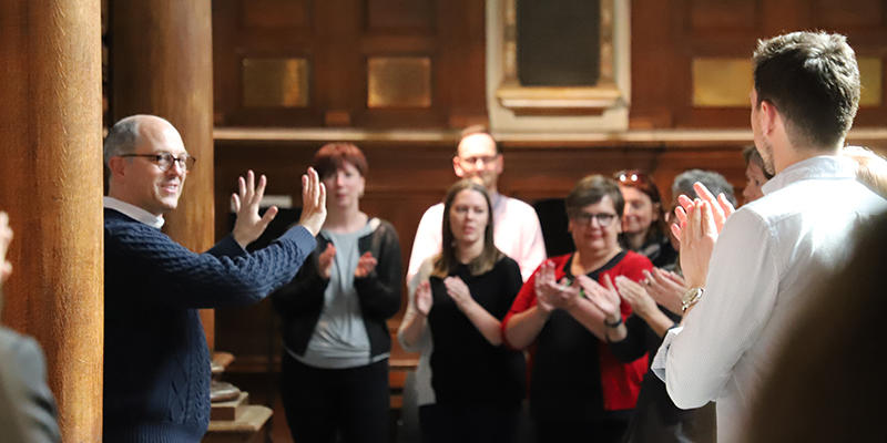 Adults clapping during Oxford Cultural Leaders session