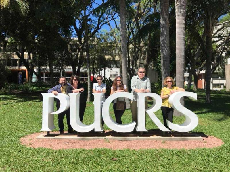 People stood behind PUCRS sculpture