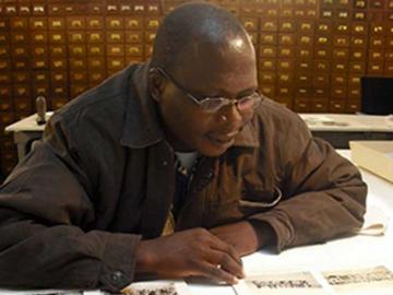 Student historian examining photographs