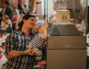Parent and Child looking at museum display