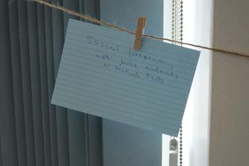 'social prescribing' written on a piece of paper, hanging to a washing line
