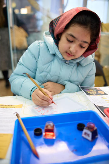 child practicing calligraphy