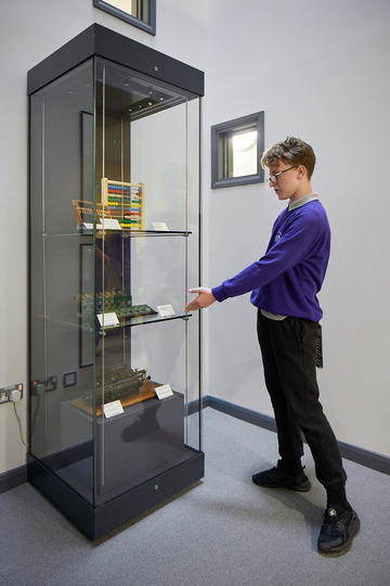 Boy pointing to museum display
