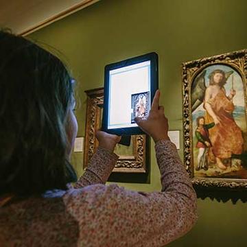 Use of a mobile device to examine art work at the Ashmolean Museum