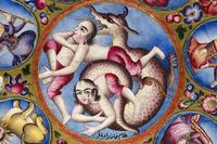 A decorated saucer with a series of roundels inscribing the seven classical planets – Sun, Moon, Mercury, Venus, Mars, Jupiter and Saturn – set around a central medallion which contains a grotesque three-bodied and two-headed figure wrestling a dragon