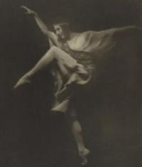 an old black and white photograph of a woman dancing Ballet