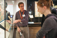 Nick Millea in the gallery with visitors