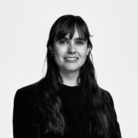Black and white portrait of a woman with long, dark hair.