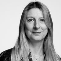 Black and white photograph of staff member Caroline Lecointe, who has fair hair.